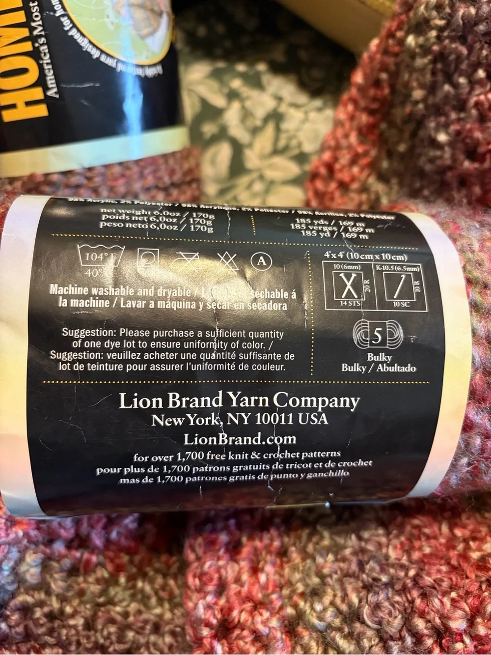 Homespun Variegated Pink Lavender Crochet Throw with Yarn bundle in Great Plains